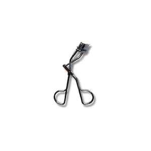 May include: A silver eyelash curler with a curved metal clamp and a handle with two loops.