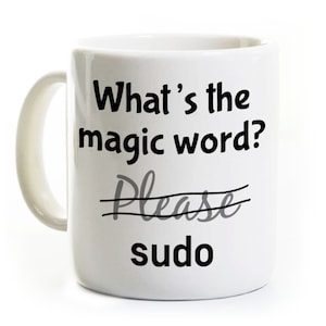 May include: White ceramic mug with the text "What's the magic word?" above the word "Please" crossed out, and the word "sudo" below. The mug has a curved handle.