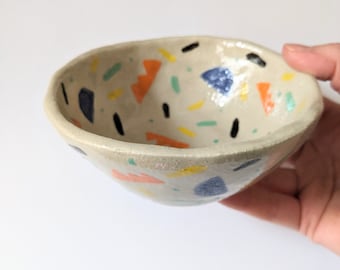 Small stoneware bowl with colorful hand-painted patterns, contemporary Memphis Design style ceramic, artisanal pottery unique piece