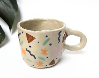Cup, stoneware mug with colorful hand-painted patterns inspired by Memphis Design, artisanal pottery unique piece