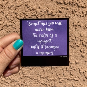 May include: A purple card with a quote by Dr. Seuss that reads "Sometimes you will never know the value of a moment, until it becomes a memory."