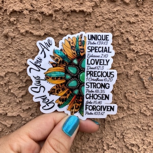 May include: A sticker with a sunflower design and the text "God Says You Are" on the left side and a list of positive affirmations with corresponding Bible verses on the right side. The affirmations include "Unique", "Special", "Lovely", "Precious", "Strong", "Chosen", and "Forgiven".