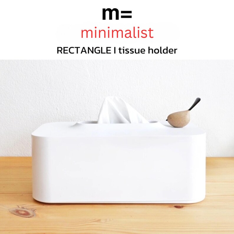 May include: White rectangular tissue box holder with a small wooden bird figurine on top. The box is labeled "m= minimalist RECTANGLE | tissue holder".