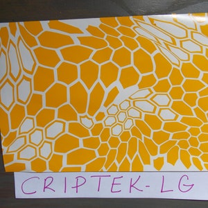 May include: A white and yellow camouflage pattern stencil. The stencil is made of a thin, flexible material and is designed to be used with spray paint. The stencil is labeled "CRIPTEK-LG".