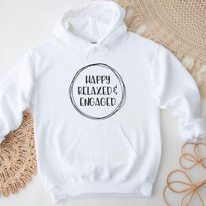 May include: White hooded sweatshirt with the text "Happy Relaxed & Engaged" in a black circle on the front.