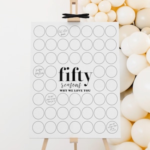 May include: A white sign on a wooden easel with the text "fifty reasons why we love you" in black. The sign has 50 blank circles for writing reasons. A cluster of white balloons is in the background.
