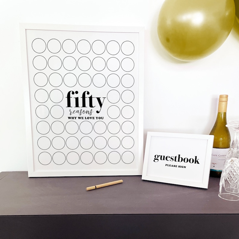 50th birthday signature board with Guestbook please sign instruction on buffet with modern gold balloons