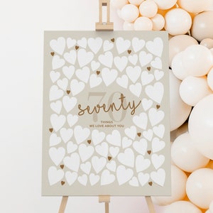 70 coisas que amamos em você Placa de assinatura bege Placa de aniversário de 70 anos Escreva mensagens Cartaz emoldurado Decoração de setenta motivos Boho Natural