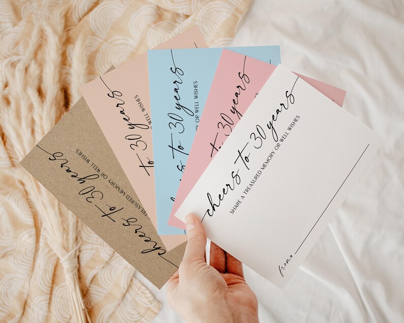 30th Birthday Wishes Cards in hand with 5 coloured paper options for guests to write their birthday messages and memories for the 30 year old woman or man