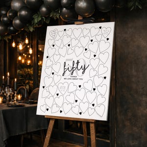 An interactive Guest Welcome Sign easel for 50th birthday party, with mood lighting at a restaurant with fairy lights.