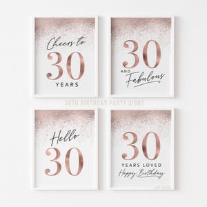 Four printable 30th birthday signs with rose gold glitter and a white background. The signs feature different phrases such as "Cheers to 30 Years",  "30 and Fabulous", "Hello 30", and "30 Years Loved Happy Birthday".