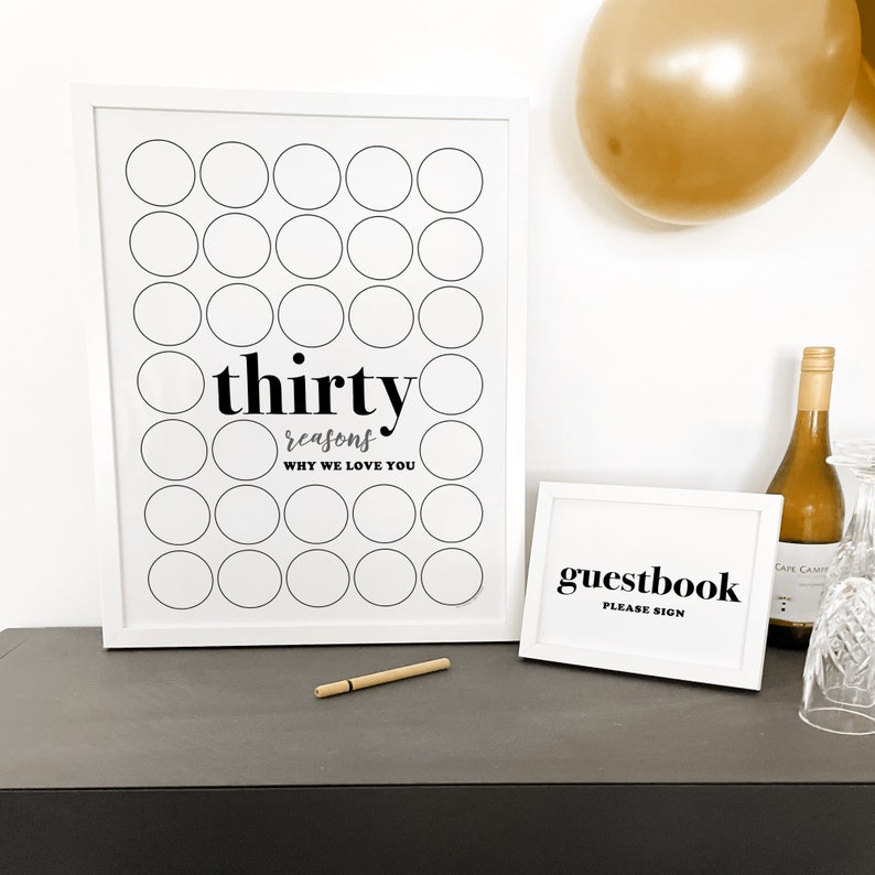 30 things we love about you poster at 30th birthday party with pen for guests to write birthday wishes on