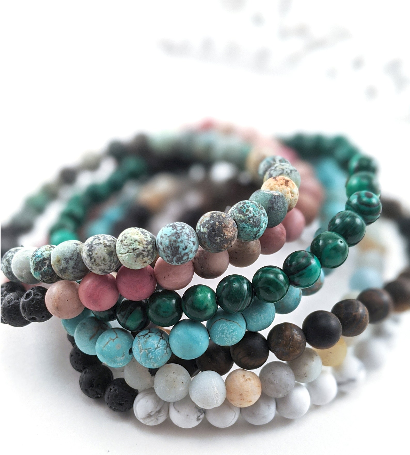 stone crystal bracelets in a stack