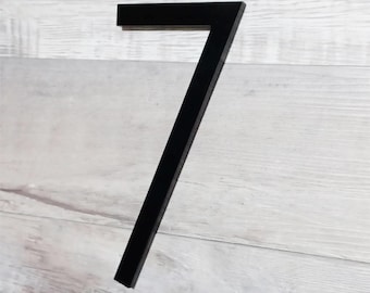 Può includere: Numero sette in metallo nero, una targa per numeri civici moderna.