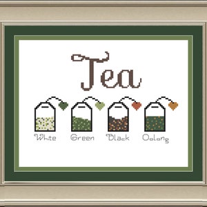 May include: A cross-stitch design featuring the word "Tea" with four tea bags labeled "White", "Green", "Black", and "Oolong".