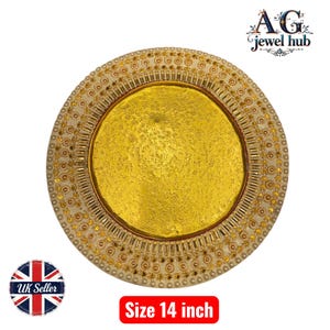 May include: A decorative gold-coloured plate with a textured centre and an ornate, cream-coloured border. The plate is 35.5 cm in diameter. The image also includes the text "AG jewel hub" and "Size 14 inch".