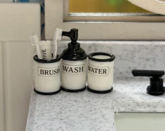 Dollhouse 1/12 scale miniature bathroom set with toothbrushes and toothpaste. Includes a glass for water, toothbrushes and soap dispenser