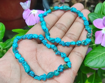 May include: Two turquoise gemstone bracelets with irregular shaped beads.
