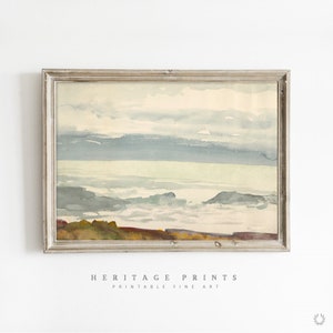 Puede incluir: Una pintura de acuarela de un paisaje marítimo con un cielo azul claro, nubes blancas y una costa verde y marrón. El agua es de color azul claro y verde, y las olas son blancas.