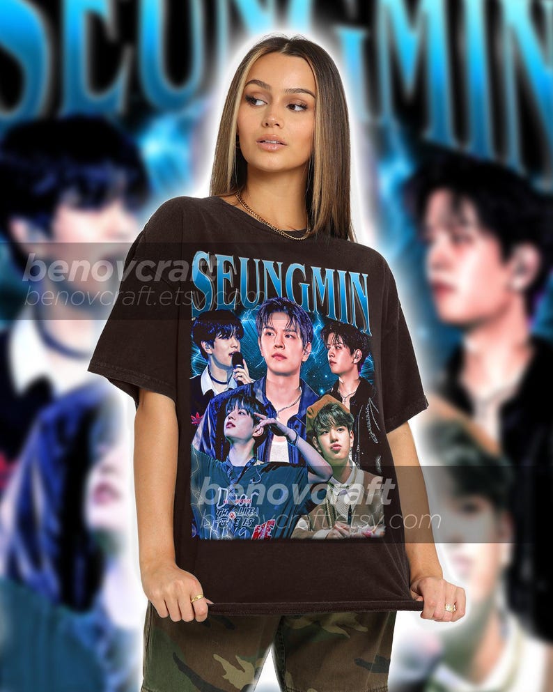 May include: A brown t-shirt with a graphic print of a band. The print features five men in a band, with the text "SEUNGMIN" above them.