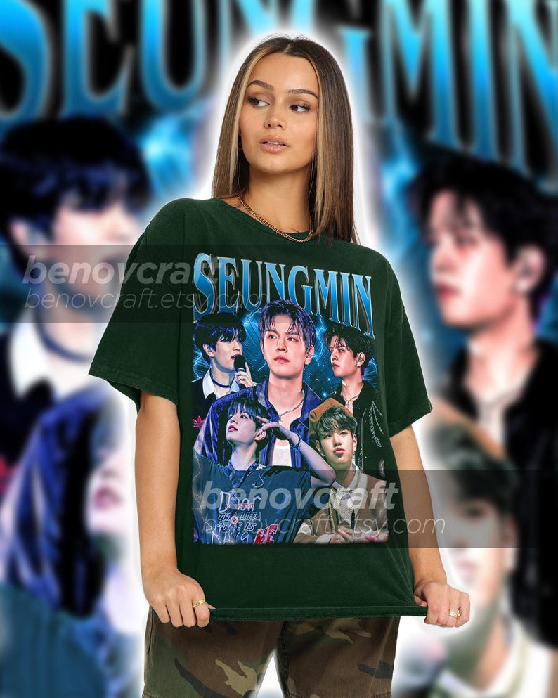 May include: A dark green t-shirt with a graphic print of a K-pop band, featuring the text "SEUNGMIN".