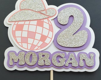 Disco cowgirl custom birthday cake topper with name and age. 3D cake topper with glitter font and cowgirl hat. Disco cowgirl birthday