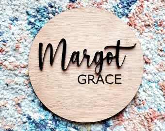 Baby name announcement sign with black acrylic name