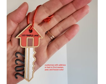New home ornament with either address, last name or first names. Customize year and house color