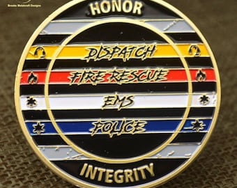 May include: Gold-colored metal coin with black and white stripes and colored bands. The words "HONOR" and "INTEGRITY" are on the top and bottom of the coin. The words "DISPATCH", "FIRE RESCUE", "EMS", and "POLICE" are on the colored bands.
