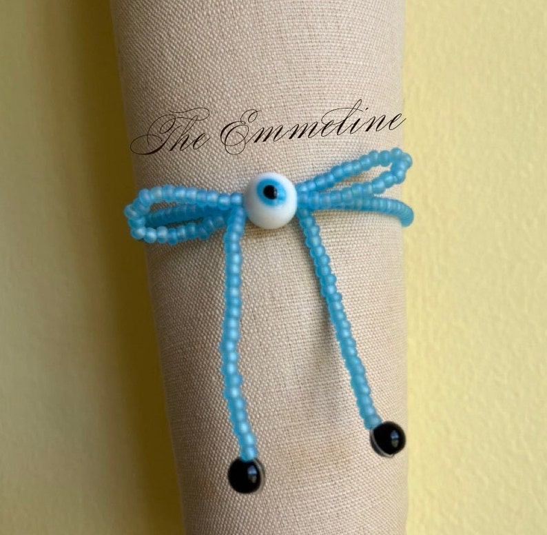 Blue Bead stretch bracelet with an evil eye