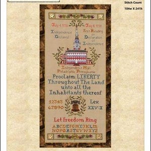 May include: A cross-stitch pattern featuring Independence Hall and the text "Let Freedom Ring." The design includes the dates July 4, 1776, and the phrase "Proclaim Liberty Throughout The Land." The pattern is framed with decorative borders and floral accents.