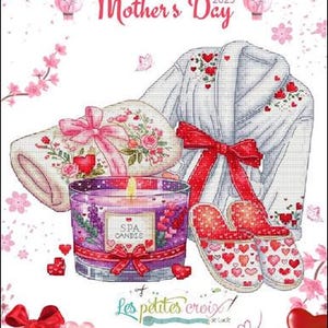 May include: Cross stitch pattern for a spa themed Mother's Day gift. The pattern includes a bathrobe, slippers, a candle, and a towel. The pattern is designed by Les Petites Croix.