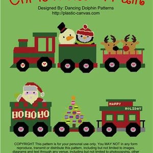 May include: A Christmas Train design on a green background. The train cars feature a snowman, penguin, reindeer, Santa Claus, a Christmas tree, and the words "HO HO HO" and "HAPPY HOLIDAY". The text "Christmas Train" is at the top.