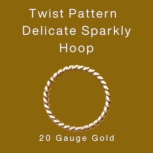 May include: A gold-coloured hoop earring with a twisted rope design. The text on the image reads "Twist Pattern Delicate Sparkly Hoop" and "20 Gauge Gold". The earring is set against a brown background.