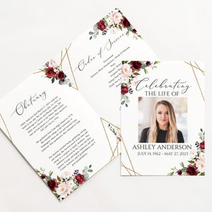 May include: A white memorial card with a gold geometric frame and floral accents. The card features a photo of a woman and the text "Celebrating the Life of Ashley Anderson July 14, 1962 - May 27, 2023".