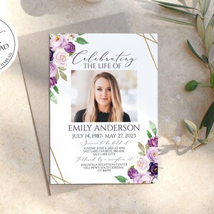 May include: A white memorial card with a gold geometric frame and purple floral accents. The card features a photo of a woman and the text "Celebrating the life of Emily Anderson July 14, 1987 - May 27, 2023".