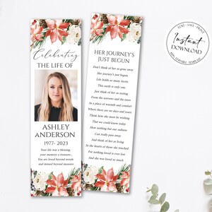 Peut inclure: Un marque-page sur le thème de Noël avec un motif floral dans les tons rouge, blanc et vert. Le marque-page présente une photo d'une femme et le texte "Celebrating the Life of Ashley Anderson 1977-2023". L'autre côté du marque-page contient un poème intitulé "Her Journey's Just Begun".