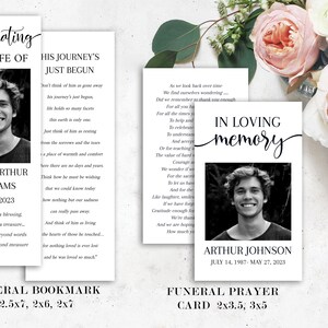 May include: Black and white memorial cards and bookmarks. The cards feature a photo of a young man, the text "In Loving Memory", and dates. The bookmarks include a photo, name, dates, and a poem. Floral arrangement in the background.