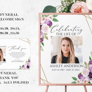 May include: Funeral welcome sign with a gold frame and purple and white floral design. The sign includes a photo placeholder and the text "Celebrating the life of" and "Ashley Anderson, July 14, 1967 - May 27, 2023".