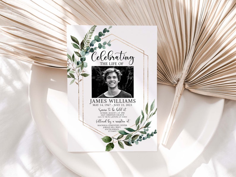 May include: A white memorial card with a gold geometric frame and green foliage. The card reads "Celebrating the Life of James Williams May 14, 1967 - July 22, 2023 Service to be held at Sunday August 4 at 9:00 am Salt Christian Church 1611 N 700 W, Layton, UT 84041 followed by a reception at Magnolia Cemetery Center Jordan Hill Drive South Jordan, UT 84095". A black and white photo of a man is in the center of the card.