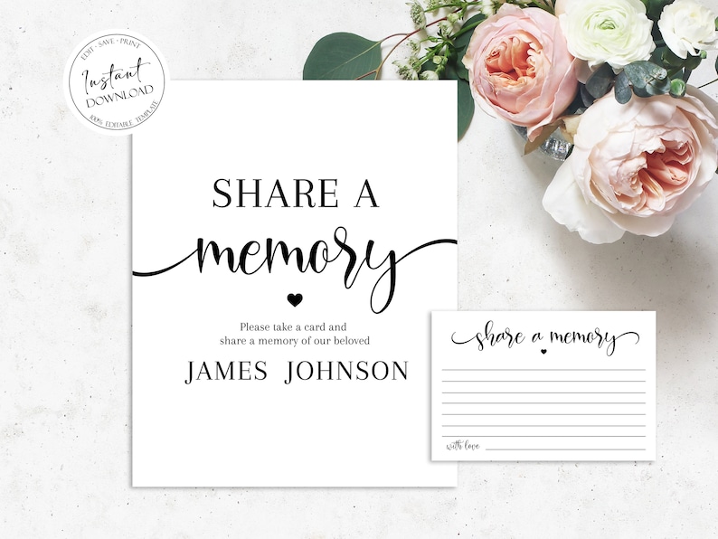 Op de afbeelding: Een wit bord met zwarte tekst die "SHARE A memory" zegt met een klein hartje. Onder de tekst staat "Please take a card and share a memory of our beloved JAMES JOHNSON". Een kleiner wit kaartje met zwarte tekst die "share a memory" zegt met een klein hartje staat rechts van het bord.