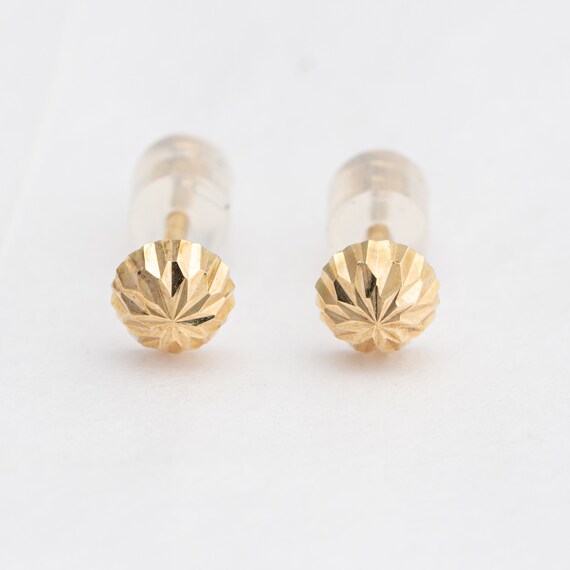 Tiny sparkling gold stud earrings in 14k yellow g… - image 1