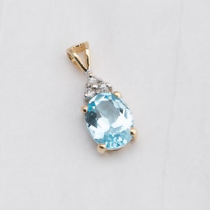 Blue Topaz Pendant 14k Yellow Gold 1/10th Carat Diamond, 9x7mm, December Birthstone