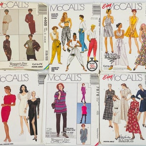 May include: Six different sewing patterns for women's clothing. The patterns are from McCall's and include a variety of styles, including dresses, tops, and pants. The patterns are all in different colors and have different sizes.