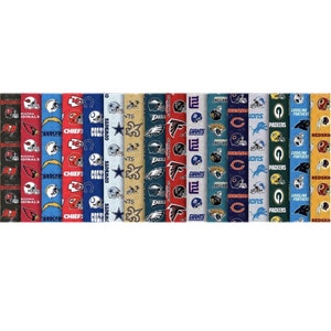 May include: Fabric rolls featuring various NFL team logos, including the Arizona Cardinals, Los Angeles Chargers, Kansas City Chiefs, Dallas Cowboys, and New York Giants. The fabric displays team helmets and logos in team colors.