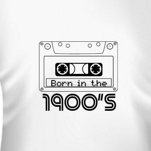 May include: White t-shirt with a black and white cassette tape graphic and the text "Born in the 1900's".