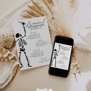May include: A black and white skeleton illustration holding a bottle of wine. The illustration is on a white card with the text "Weekend Itinerary October 17-20" printed on it. The card is on a beige surface with a dried palm leaf and a seashell.