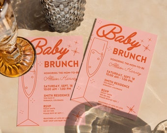 May include: Pink and orange baby shower invitation with a champagne glass graphic and the text "Baby Brunch" honouring Allison Harvey. The invitation includes the date, time, and location of the event. RSVP information is also included.