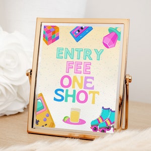 May include: A gold-framed sign with a yellow background and colorful 80s-themed graphics. The sign reads "Entry Fee One Shot".