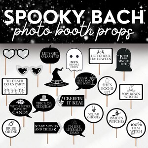 May include: A set of 16 black and white photo booth props with spooky Halloween themes. The props feature phrases like "Let's Get Smashed!" and "Boo's Before I Do's" and images of ghosts, witches, and skeletons.